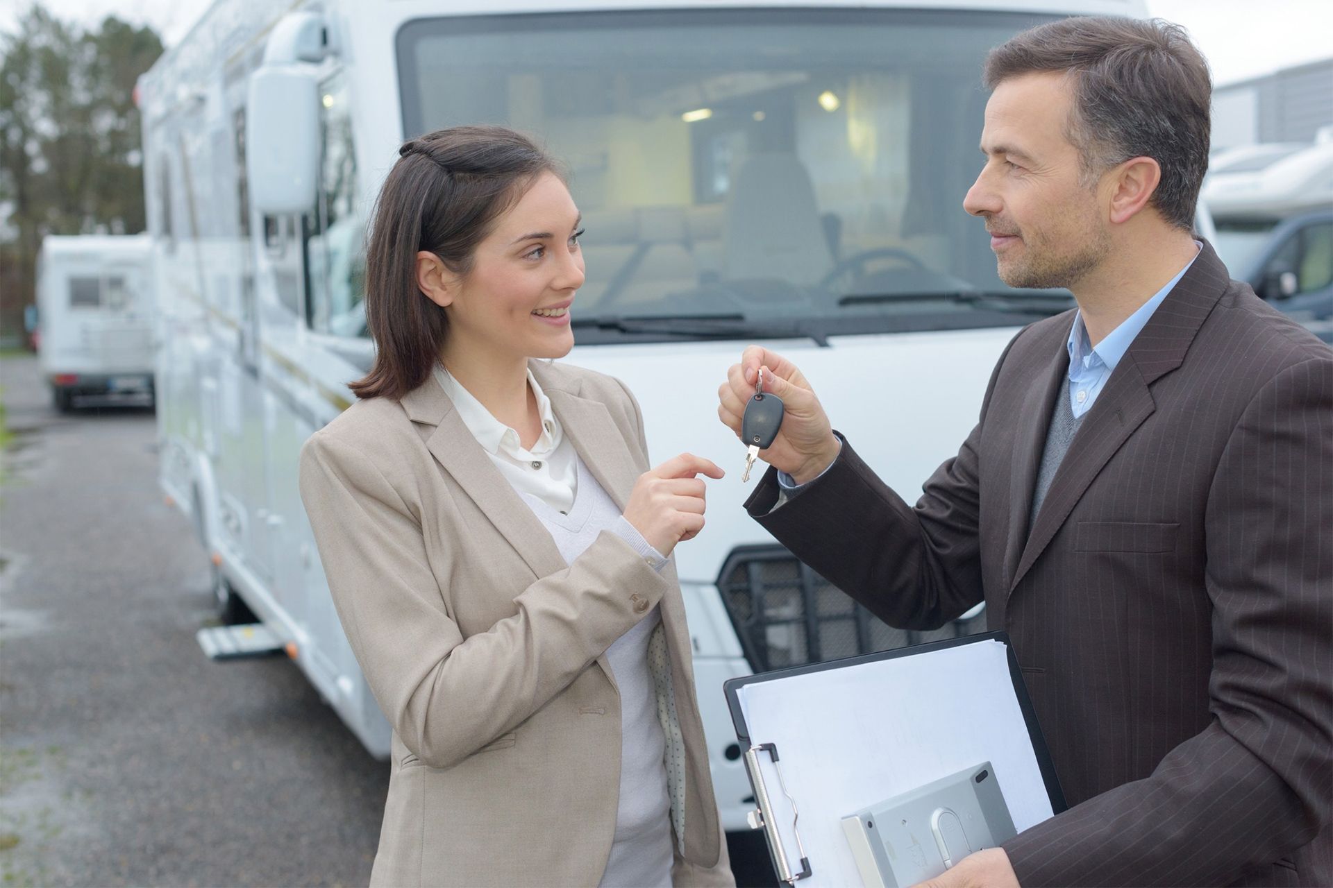 Woman Getting the Key for Her New RV