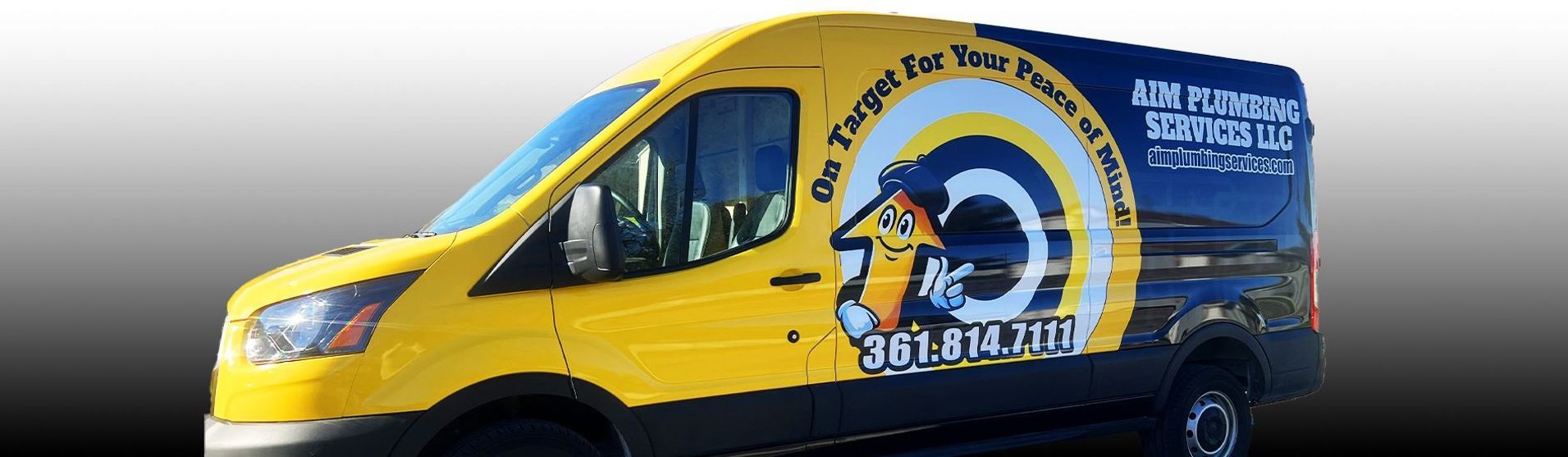 Yellow and blue van with logo of a ram, advertising 