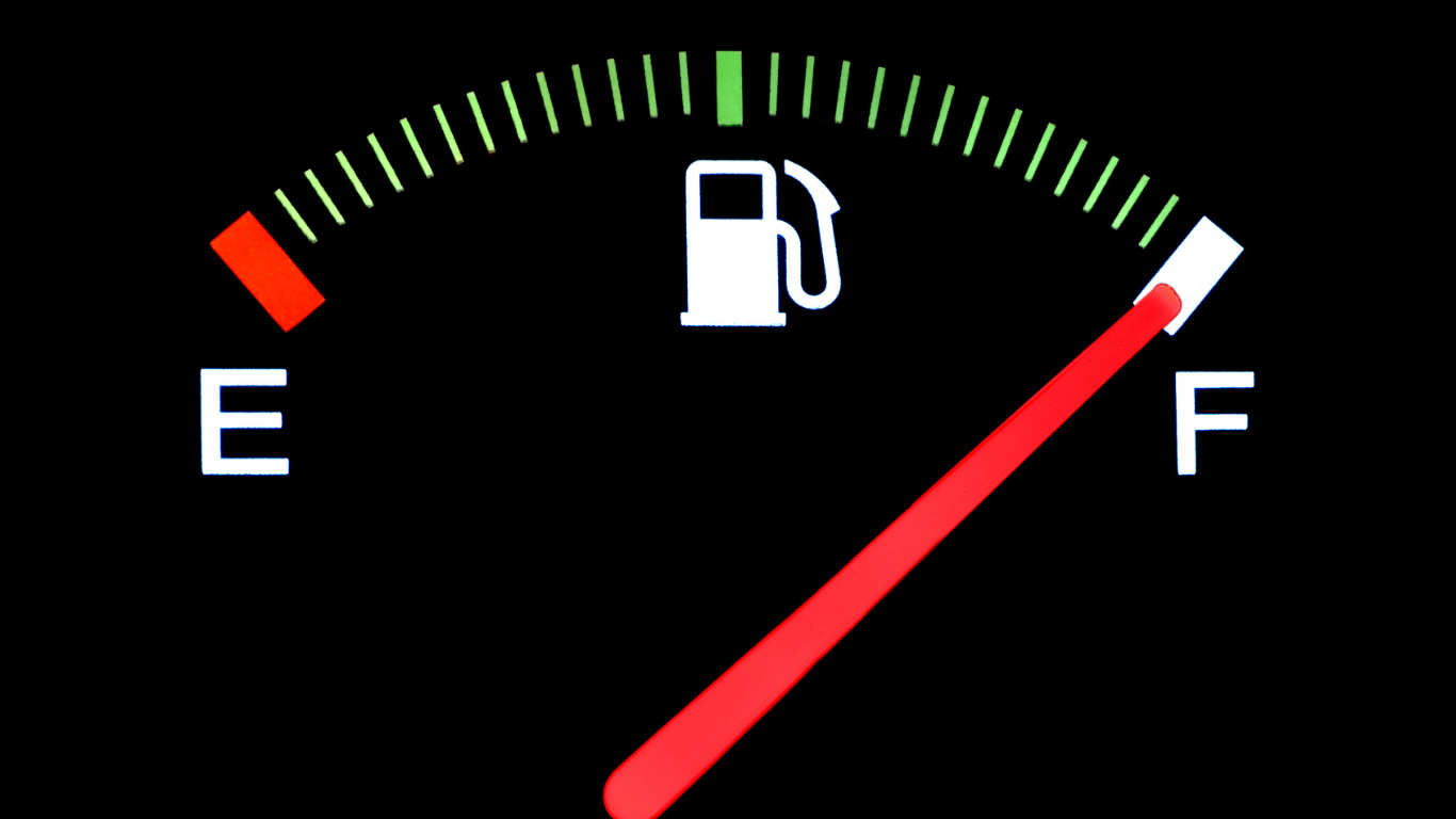 A close up of a fuel gauge showing that it is full