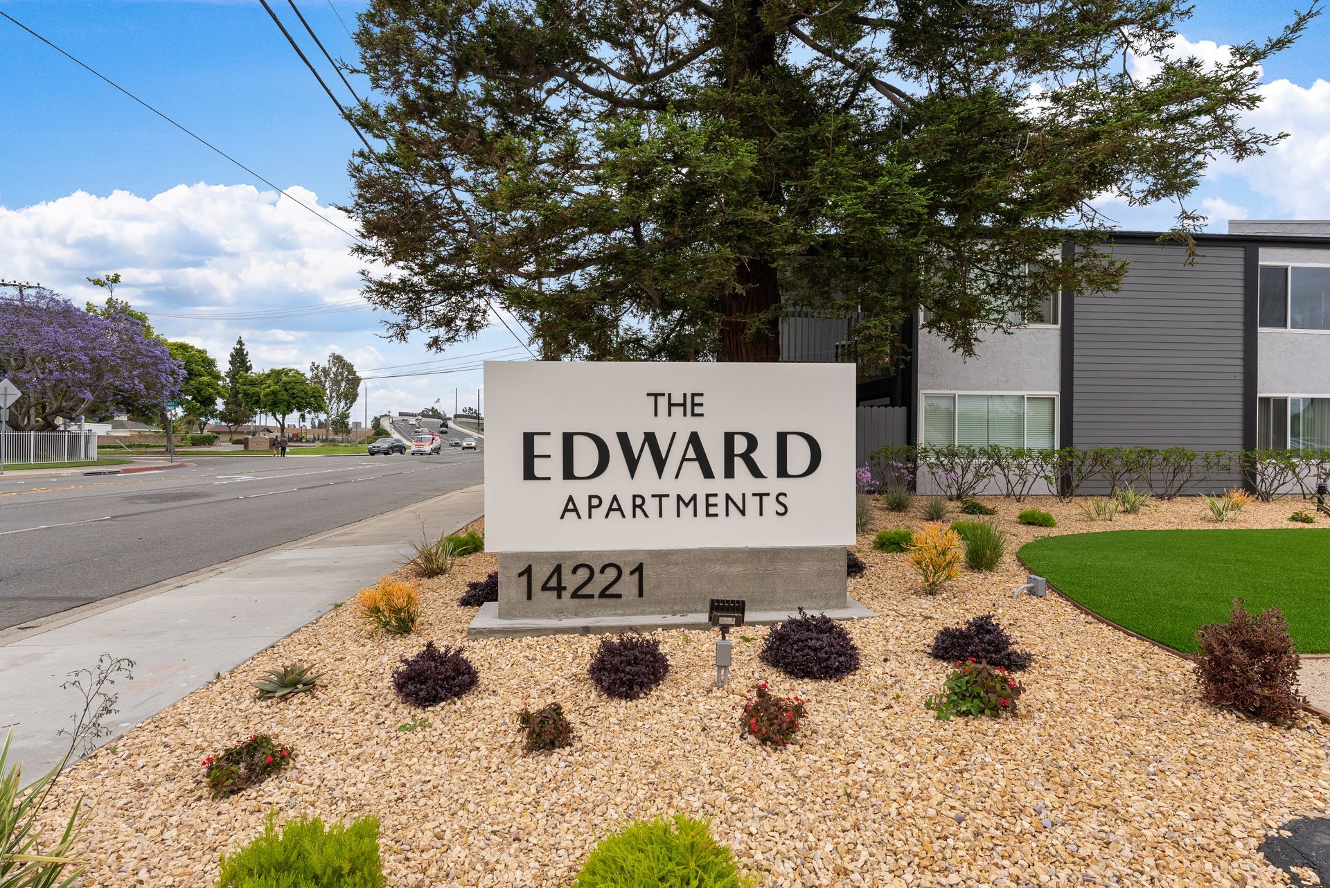 Exterior photo of The Edward Apartments - Sign