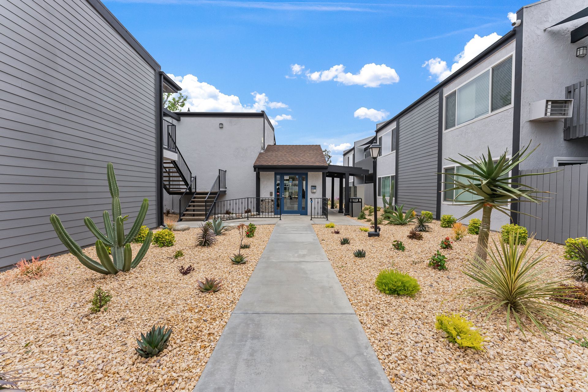 Exterior photo of The Edward Apartments - walkway