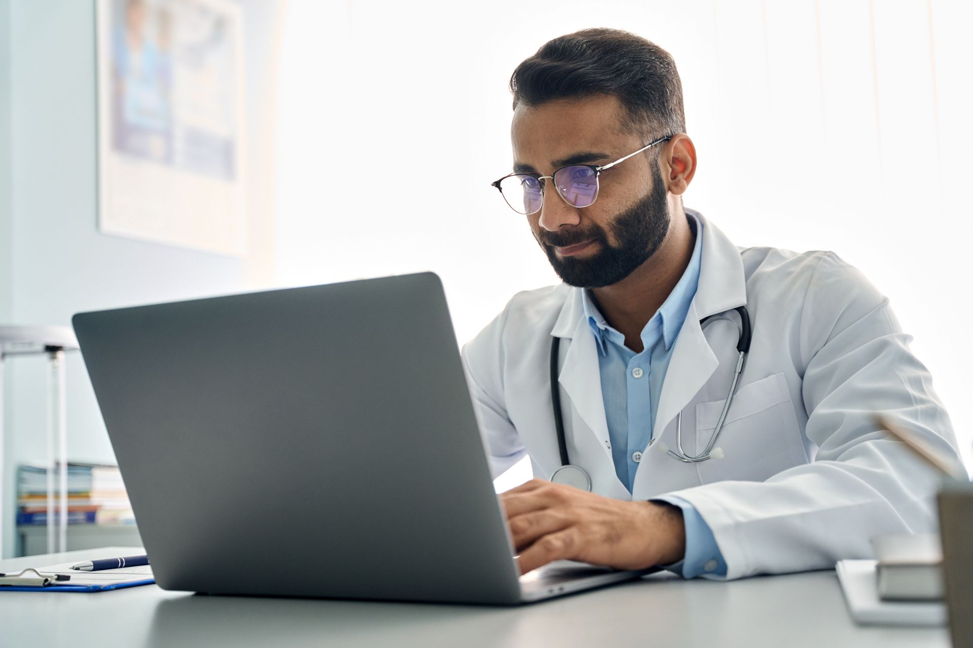 Doctor on laptop computer 
