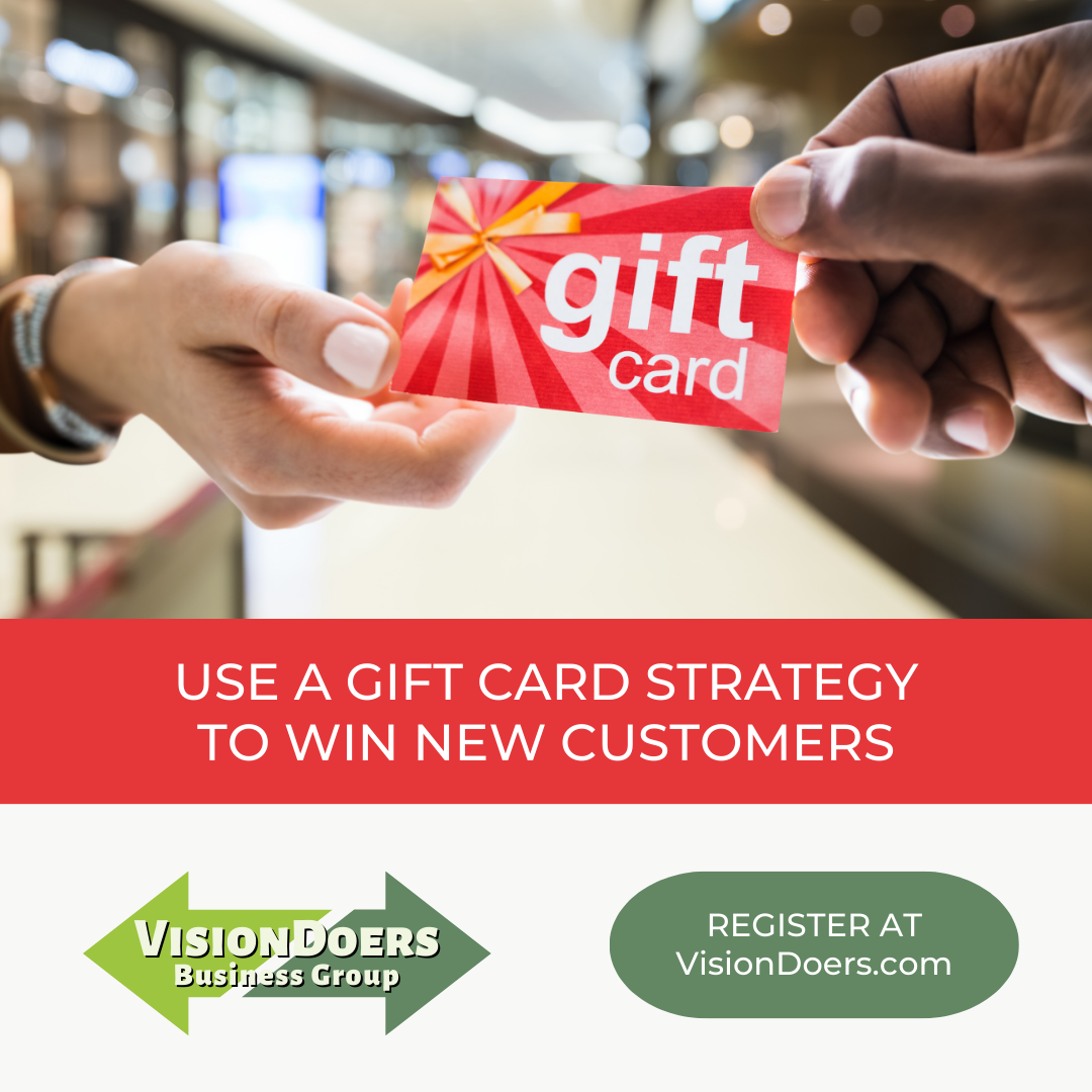 A person is handing a gift card to another person