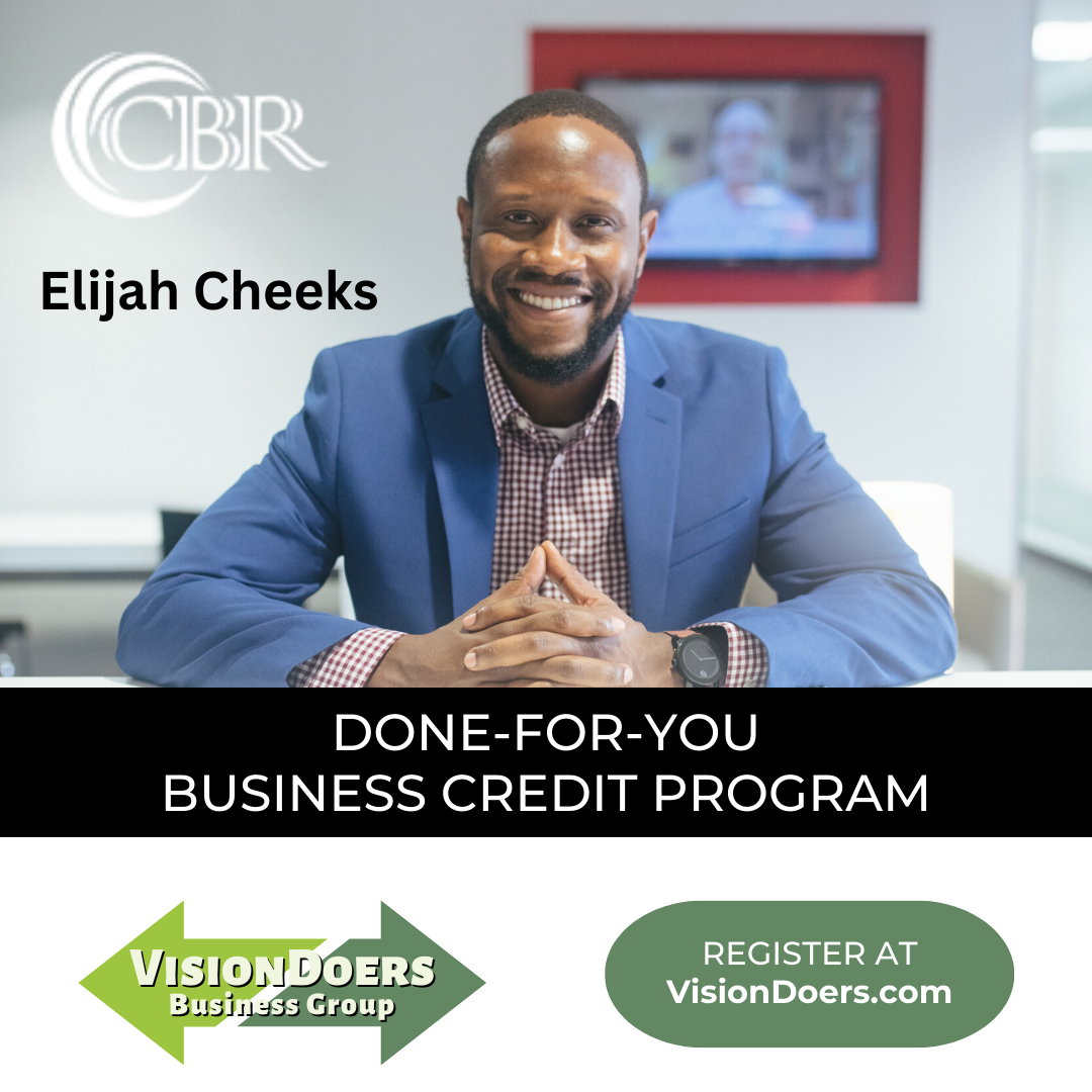 A man in a blue suit is sitting in front of a sign that says done-for-you business credit program