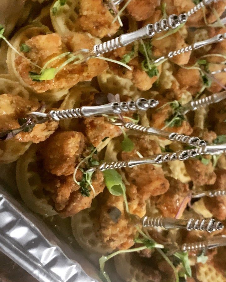 A close up of a tray of food with forks in it