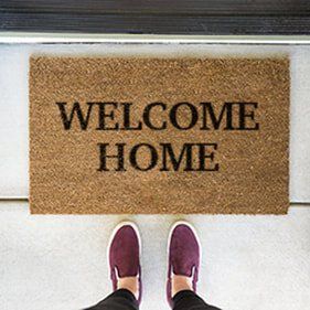 Picture of a welcome home mat in a windows and doors company in Belleville Ontario.