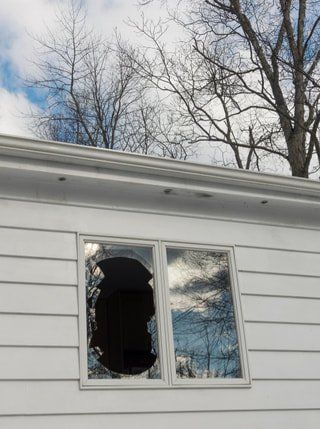 Picture of a window replacement job that needs to be repaired.  A windows and doors company near me can replace it.
