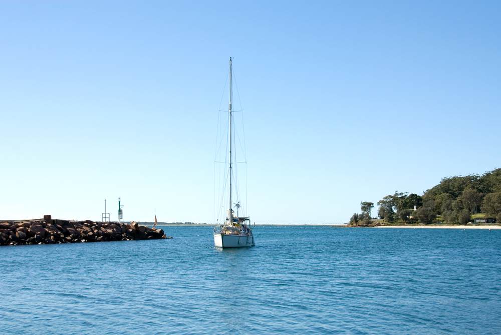 Nelson Bay Harbour With Sailing Boat — Concreting Works in Nelson Bay, NSW