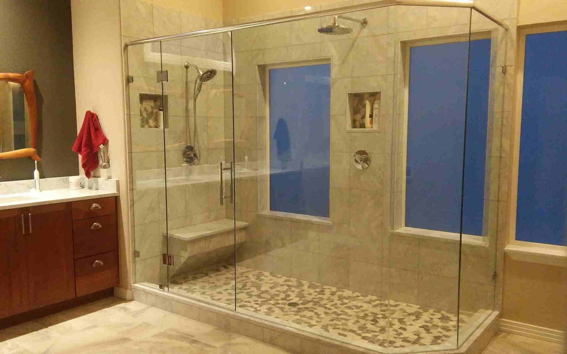 Custom frameless corner shower enclosure installed by Highlands Ranch Glass in Littleton, CO