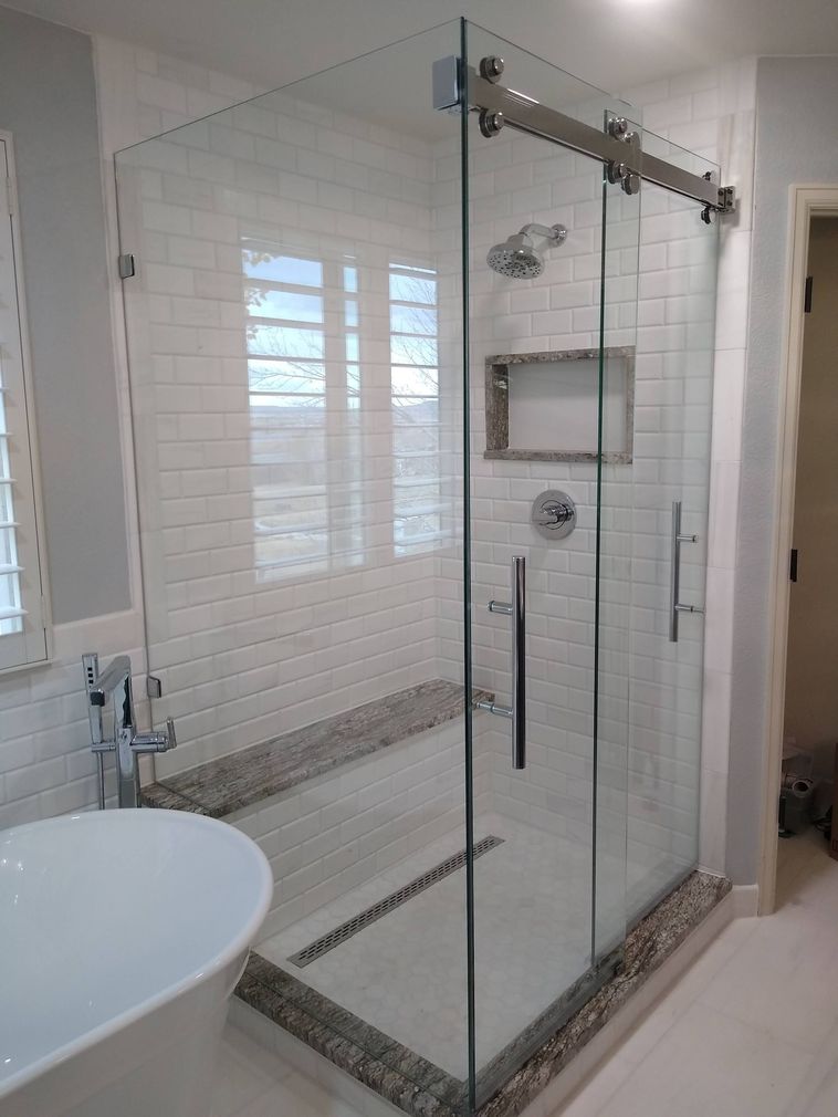 Napa frameless sliding shower door with return panel installed by Highlands Ranch Glass