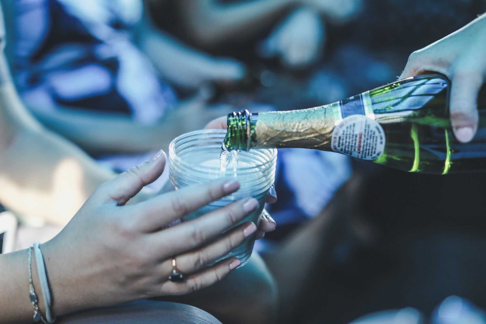 pouring a drink in a limo