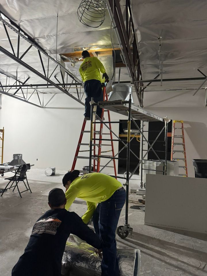 Western Sky Mechanical technician repairing AC unit in Phoenix