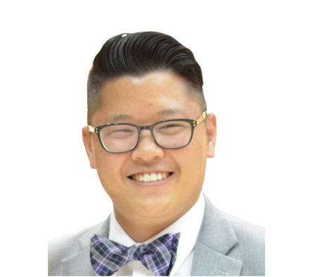 A man wearing glasses and a bow tie is smiling.