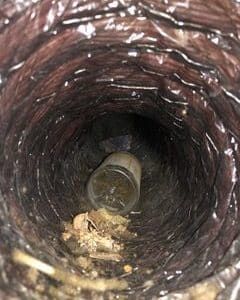 Duct With Plywood Residue - Bluffton, SC - Ugly Duct Cleaning