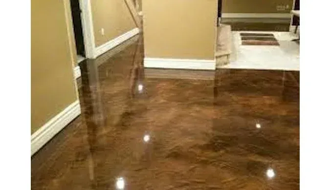 A hallway with a shiny metallic floor in a house.