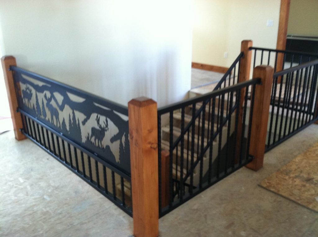 Black metal stair railing with deer silhouette design and wood posts.