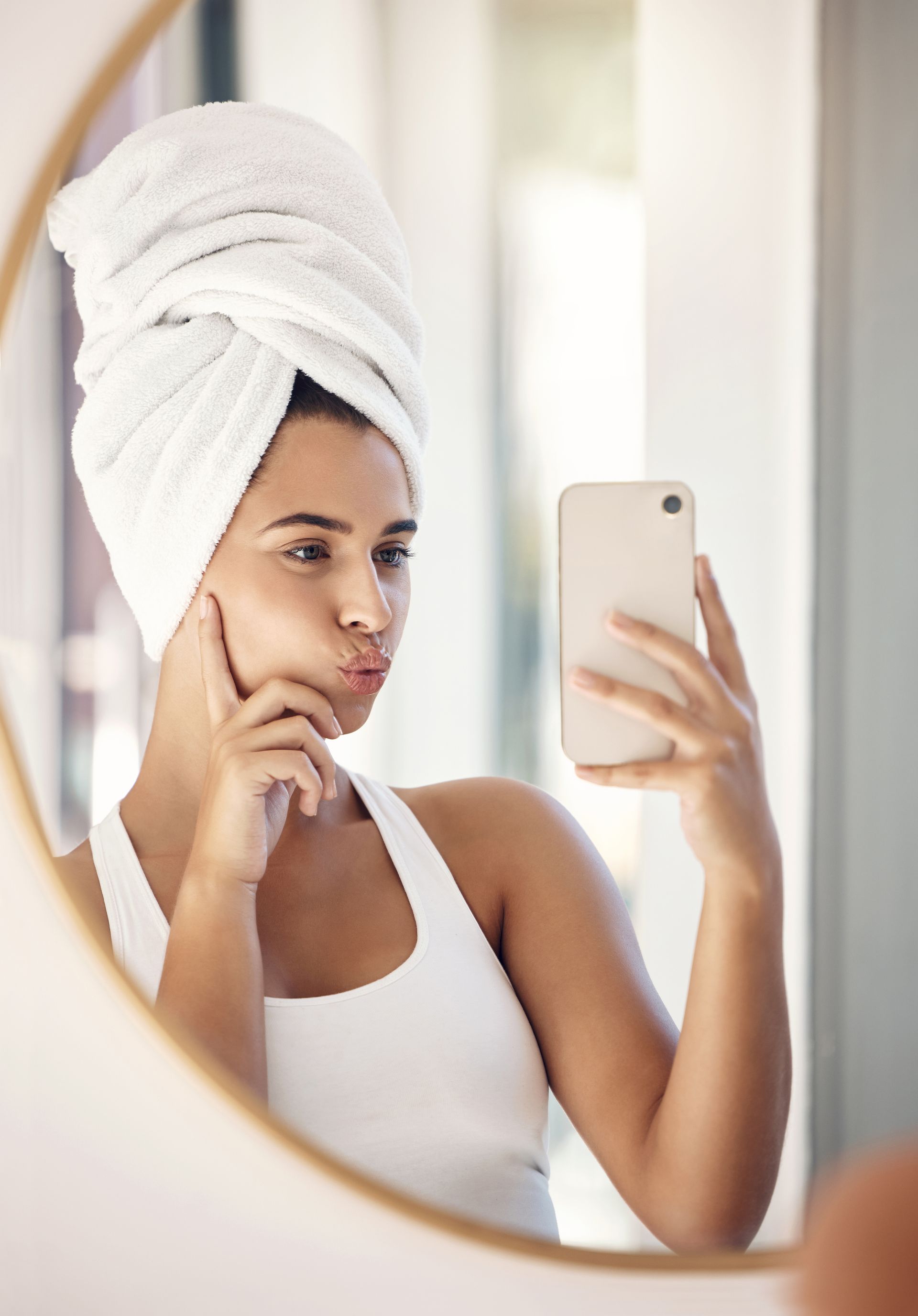 selfie of woman in hair towel