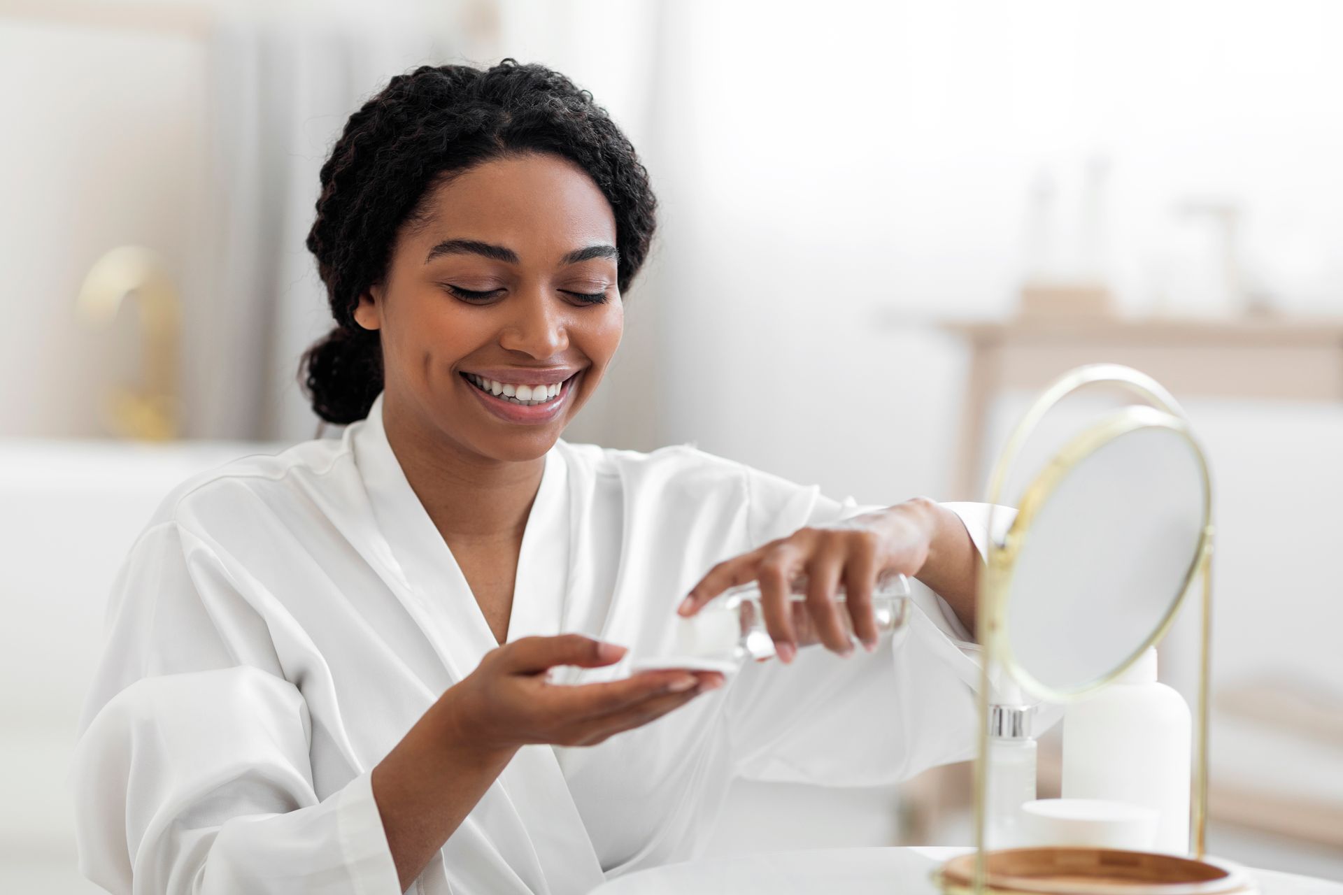 smiling woman applying skincare products on hand