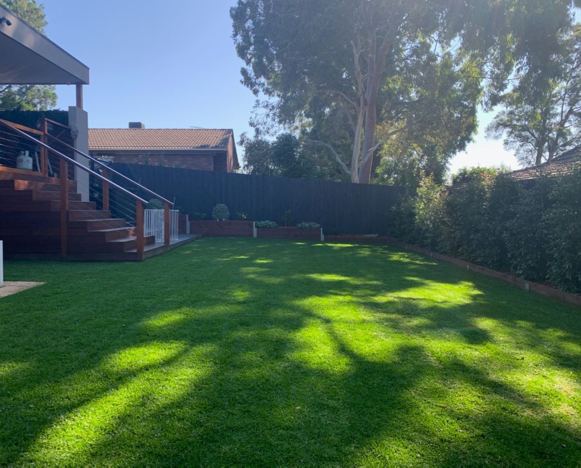 The Backyard of a House With a Lush Green Lawn — Dromana, VIC — I.S.M Concreting & Constructions