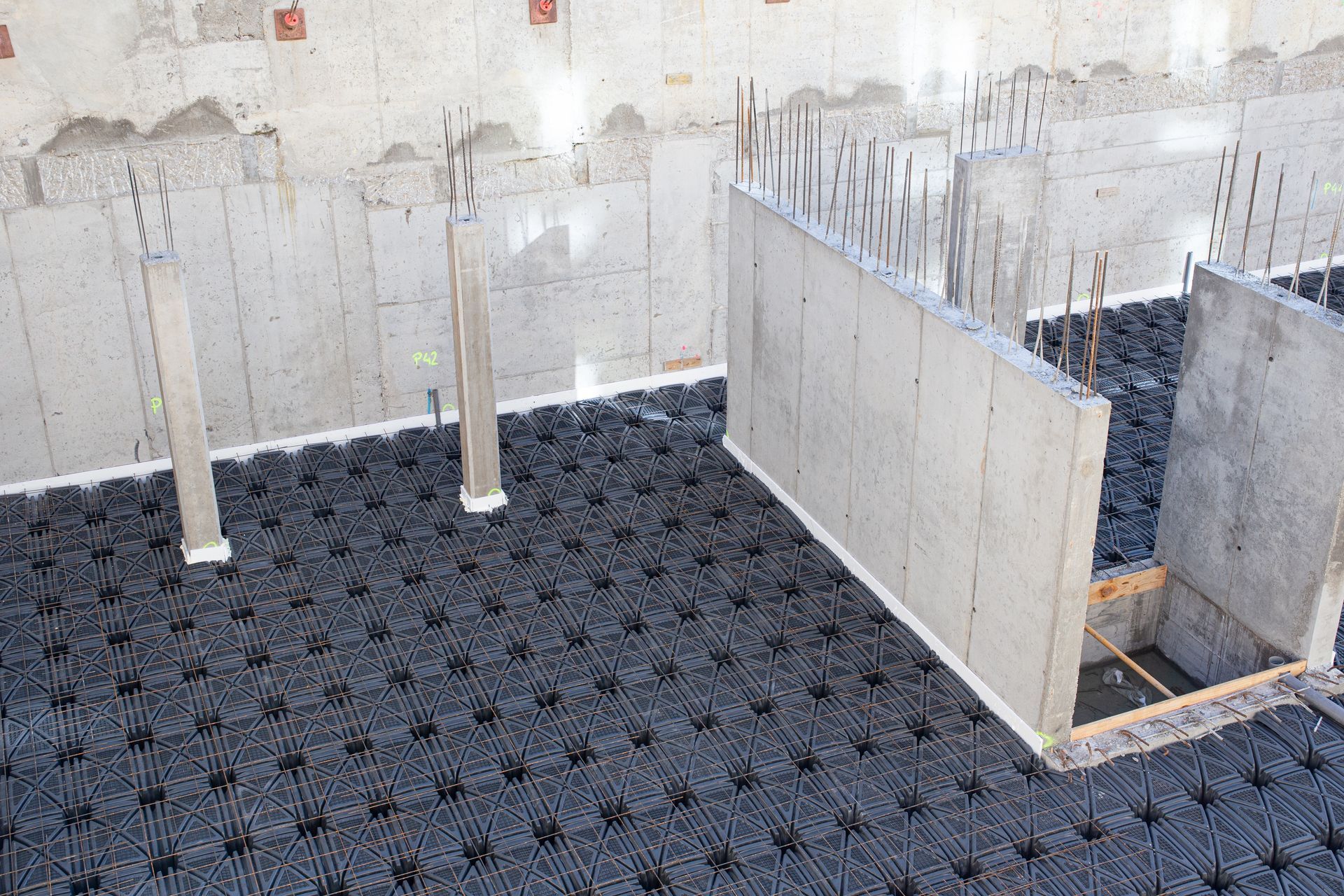 Concrete foundation basement of a building with a suspended slab.