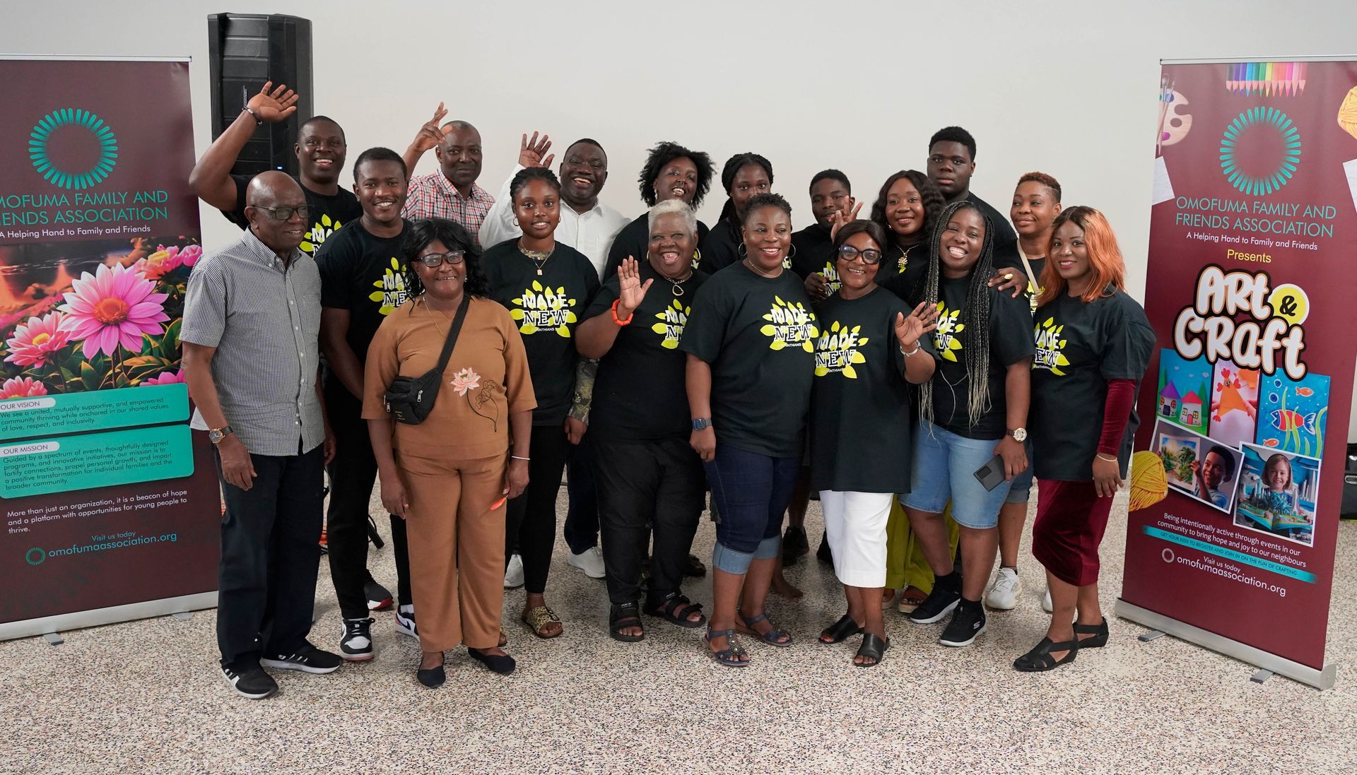 Group photo of people at an event.  Most wear black 