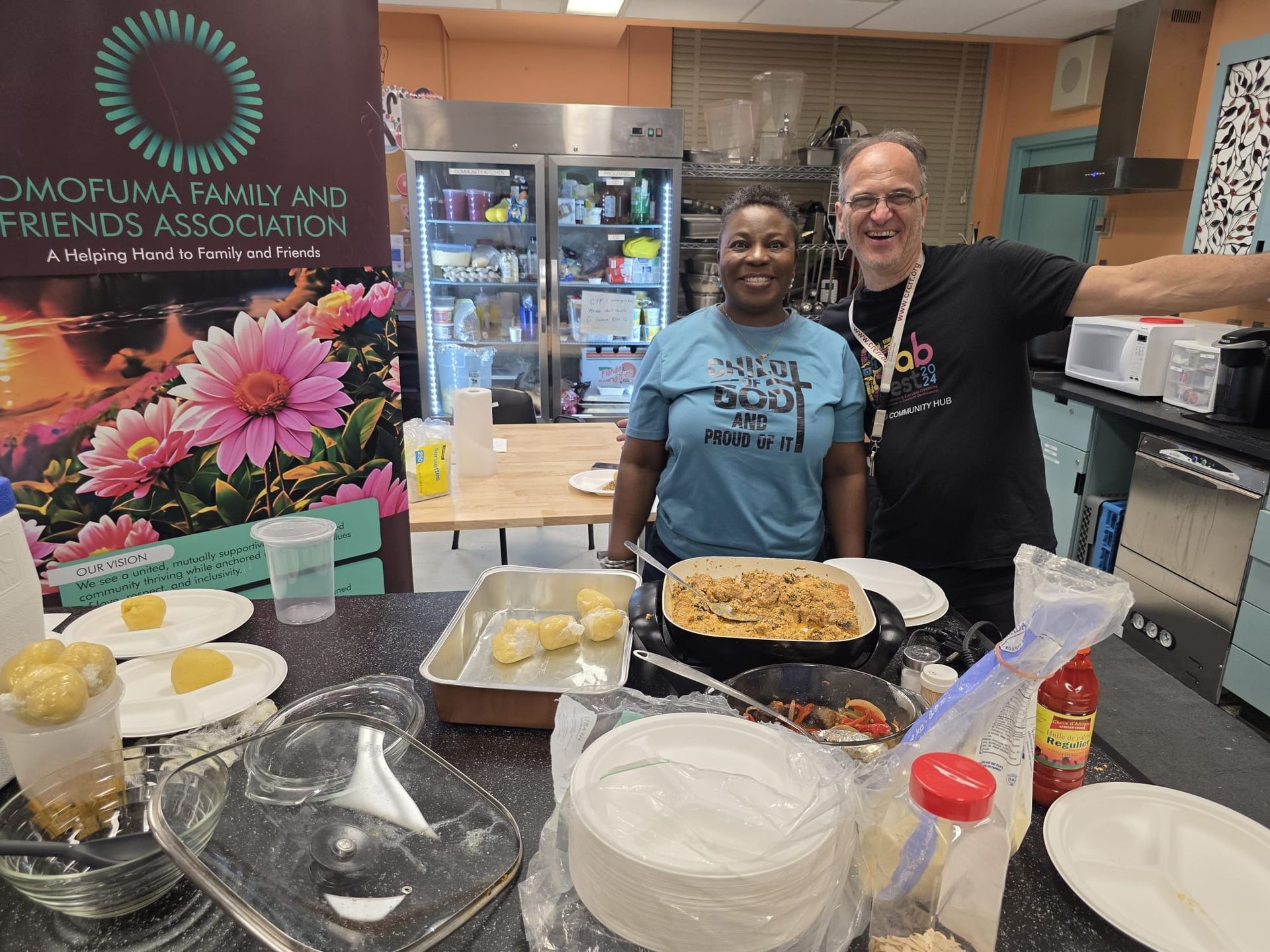 Two people in kitchen with food. Banner for family and friends association.