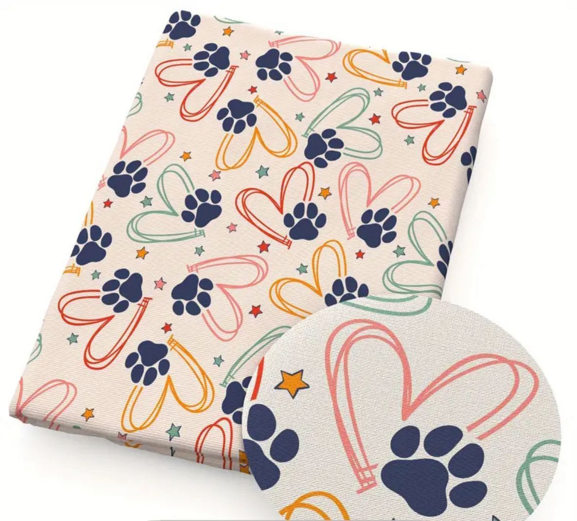 Fabric with paw prints and hearts in pastel colors.