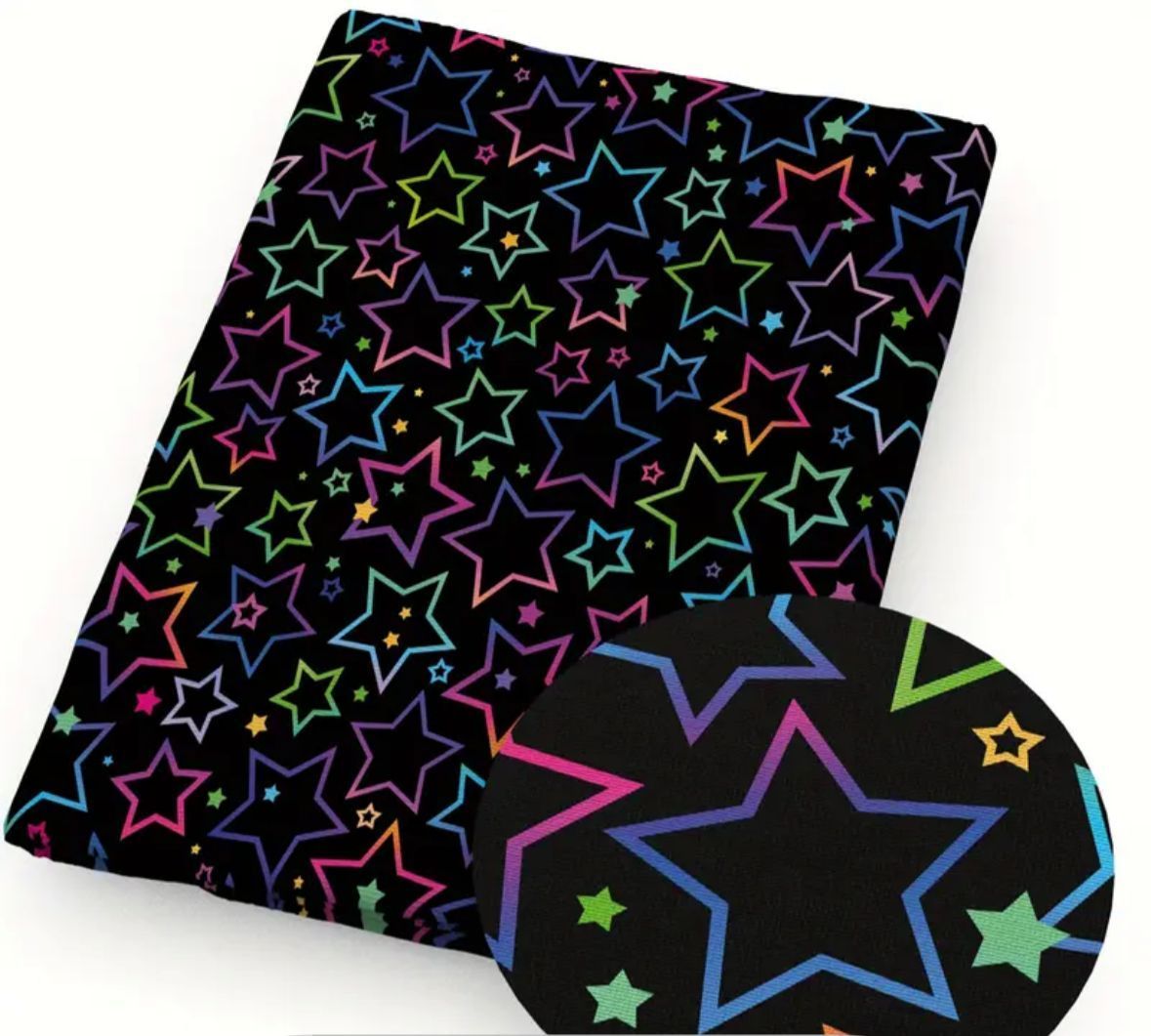 Black fabric with colorful star outlines in rainbow hues.