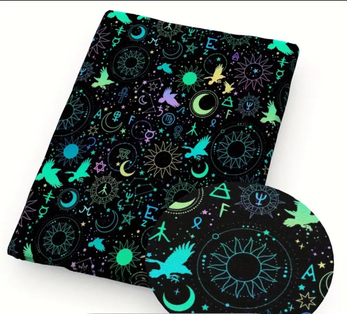 Black fabric with glowing teal celestial and mystical symbols.