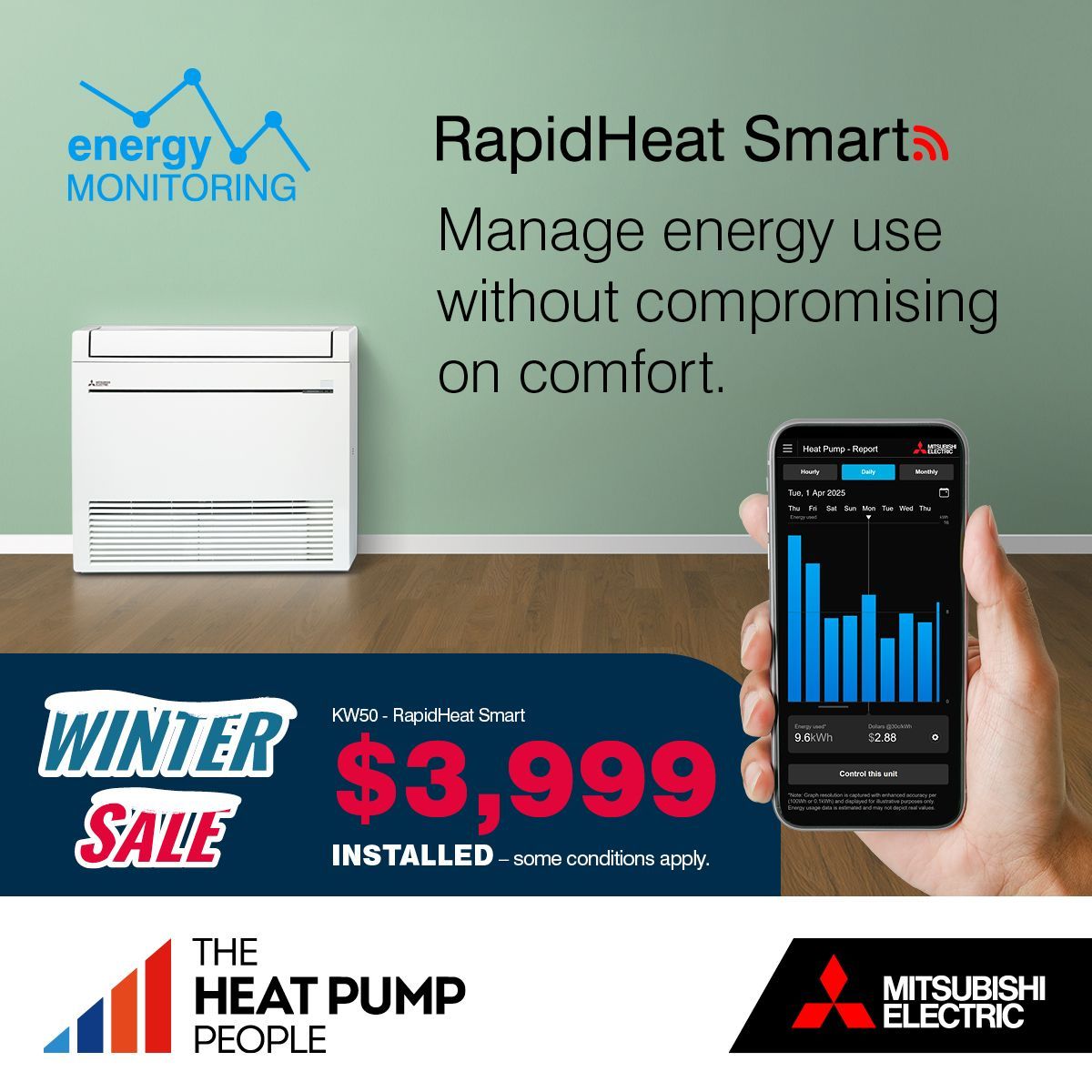 Mitsubishi Electric floor console installed on green wall with hand holding energy monitoring app on phone in foreground. 