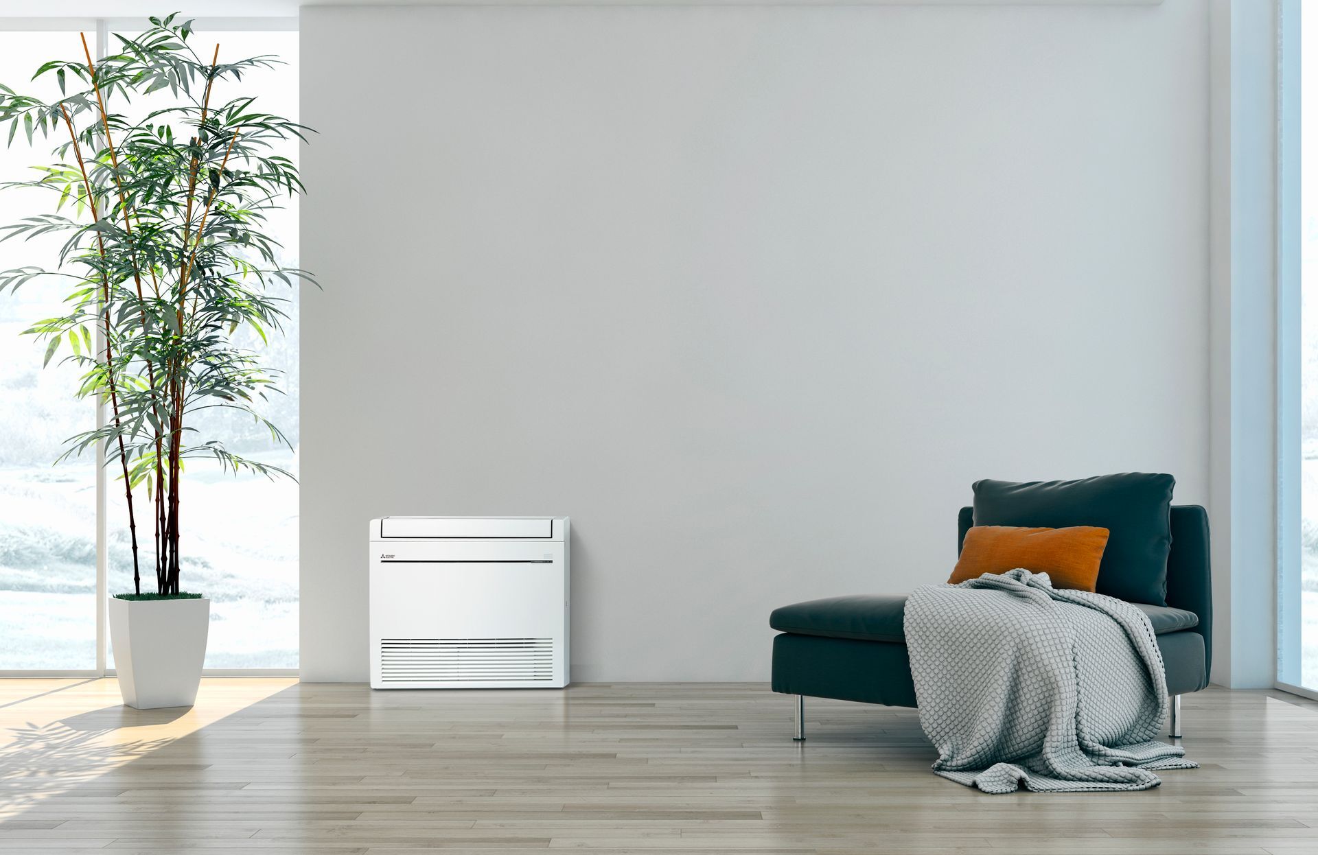 Mitsubishi Electric floor console next to plant pot and chair.