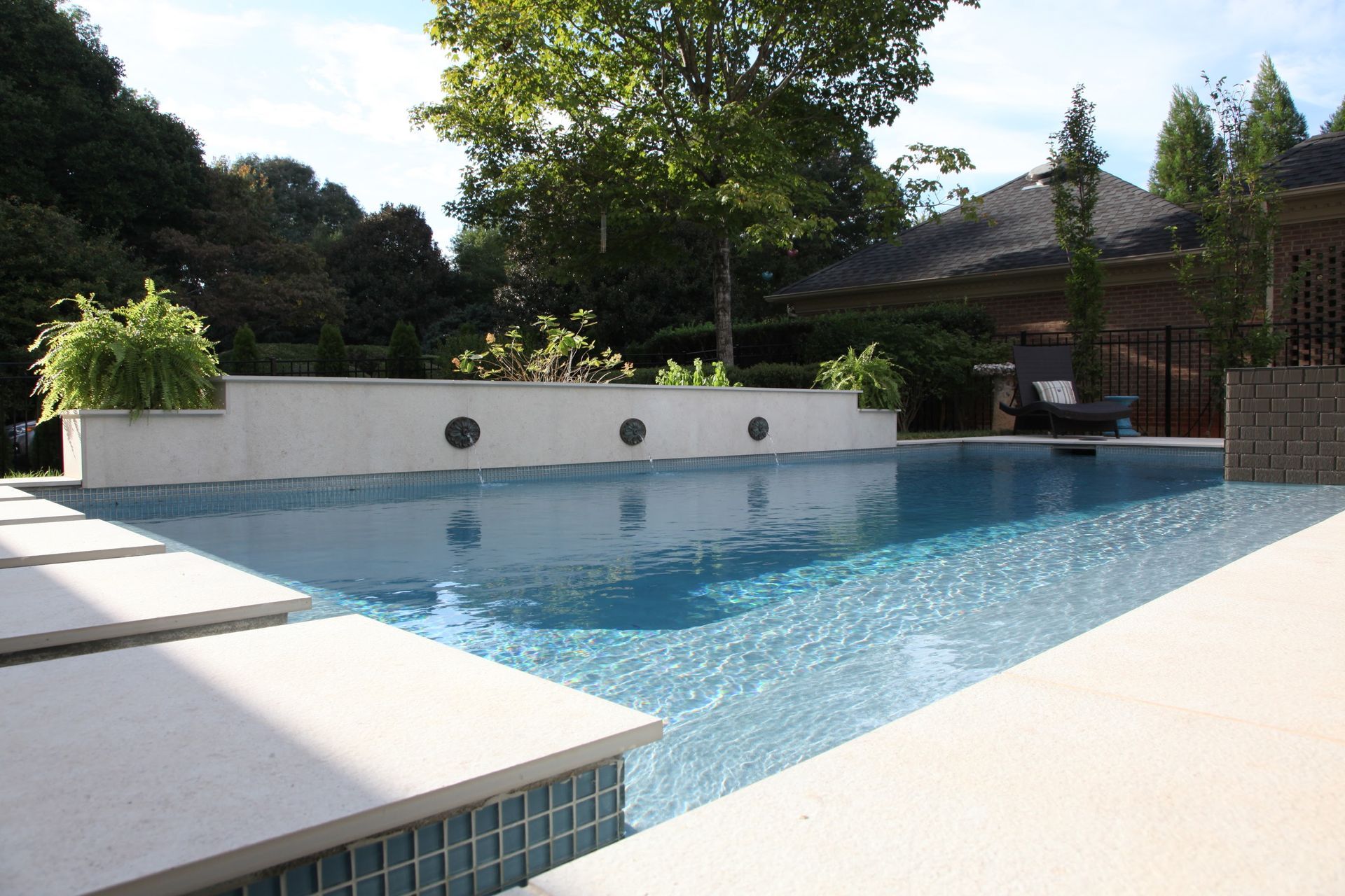 Swimming pool in back yard of a residential property.