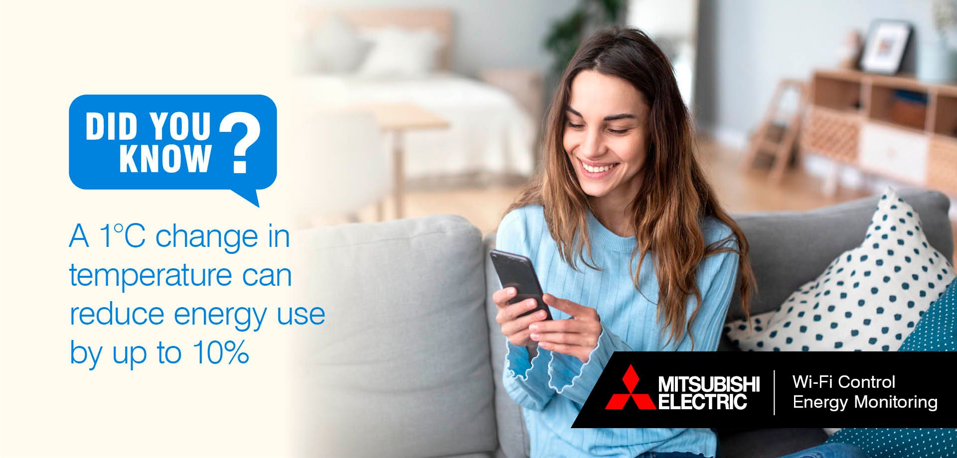 Woman on sofa looking at mobile phone