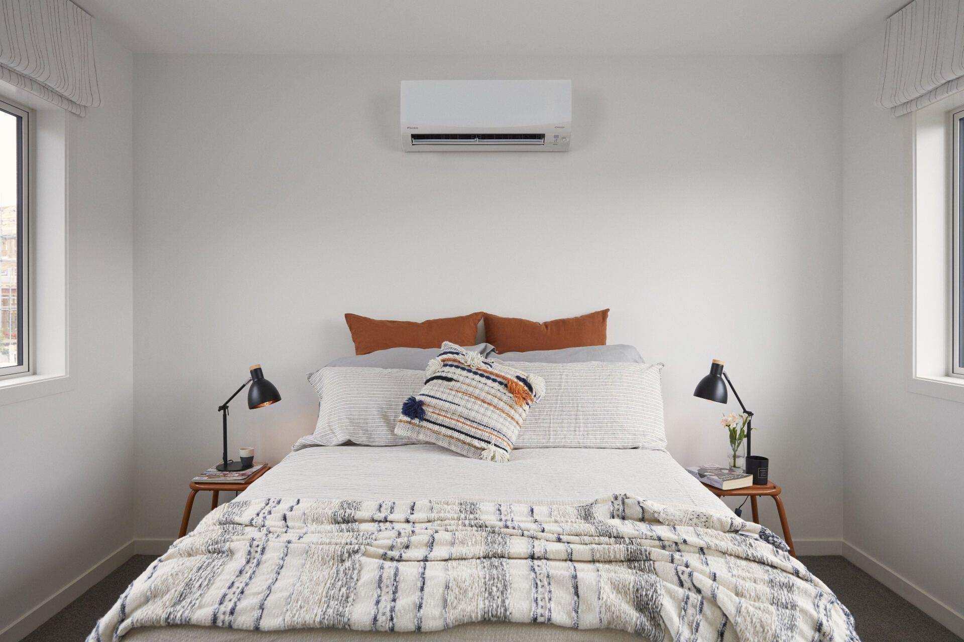 Hi-wall heat pump in small bedroom