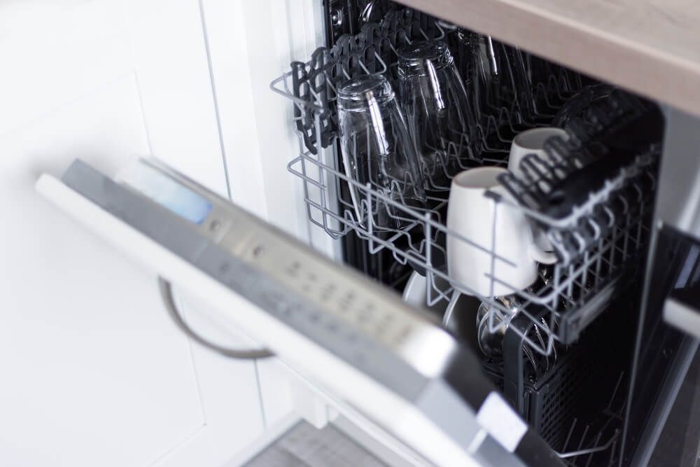 Open door of a dishwasher— Bradmark Appliance Service in Garbutt, QLD
