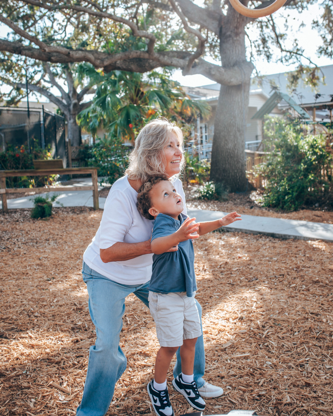 woman playing with kids who have adhd