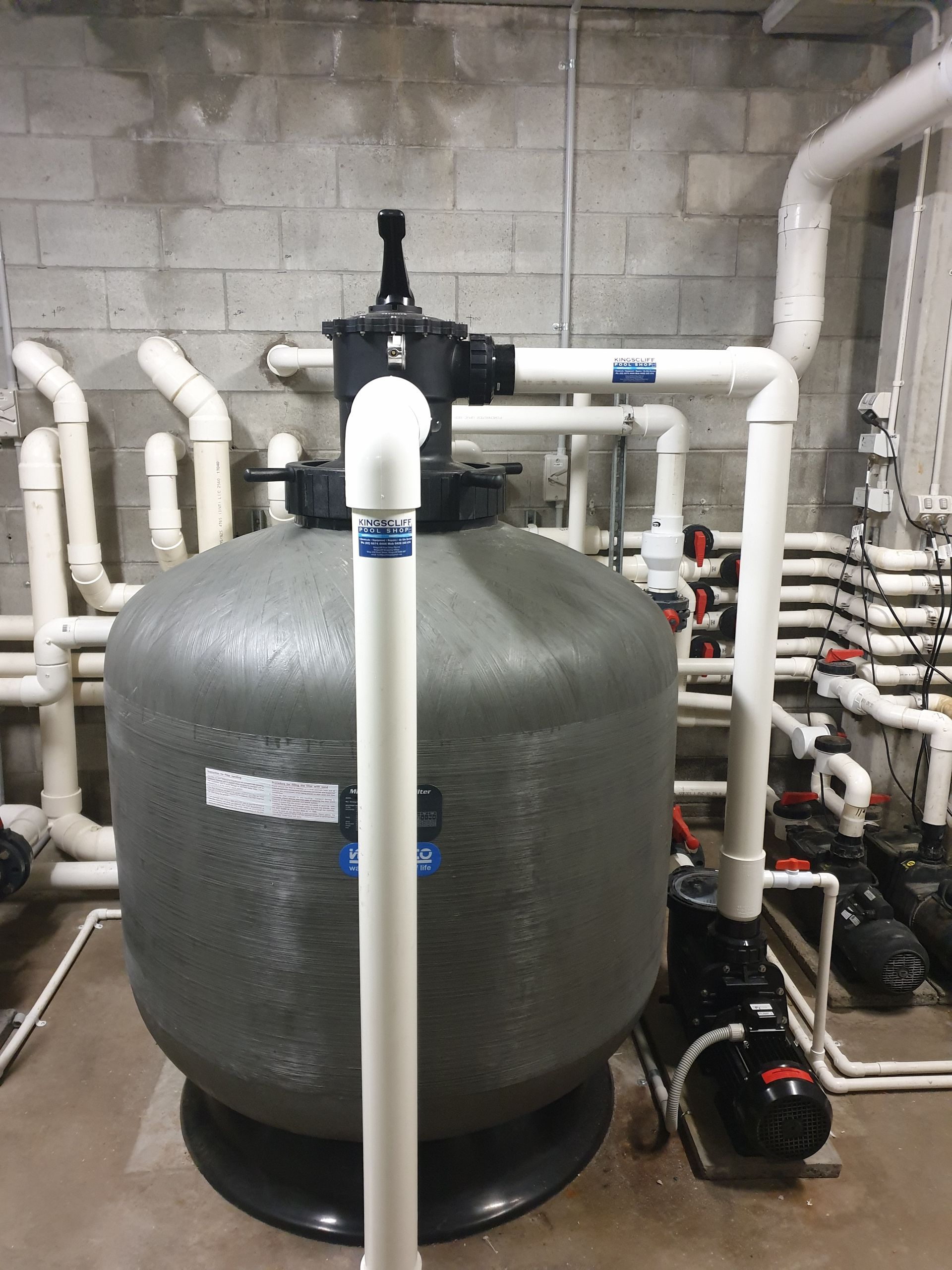 A Swimming Pool With Blue Tiles And Bubbles Coming Out Of It — Kingscliff Pool Shop In Kingscliff, NSW