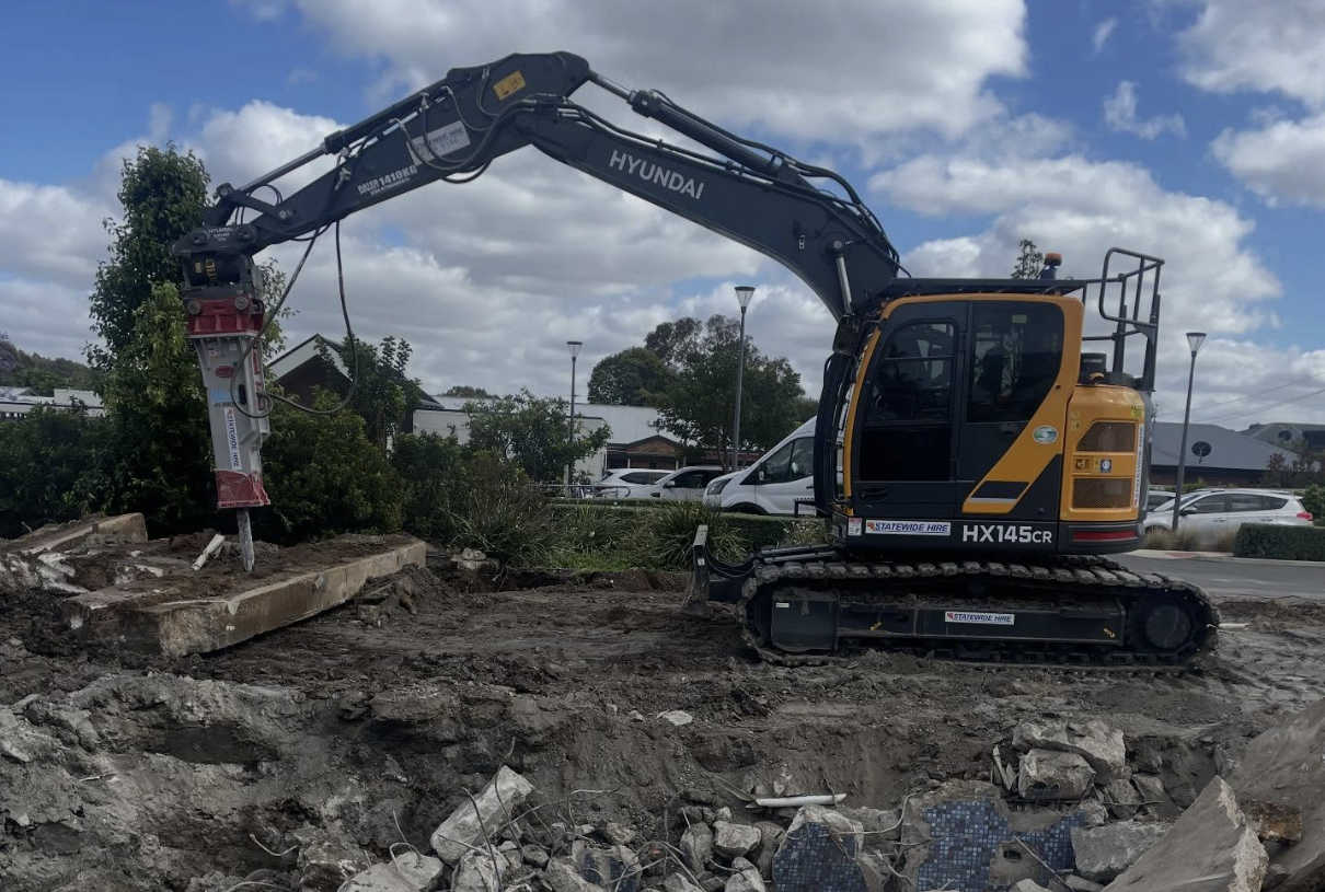 Statewide Hire excavator being unloaded and used on site in Adelaide
