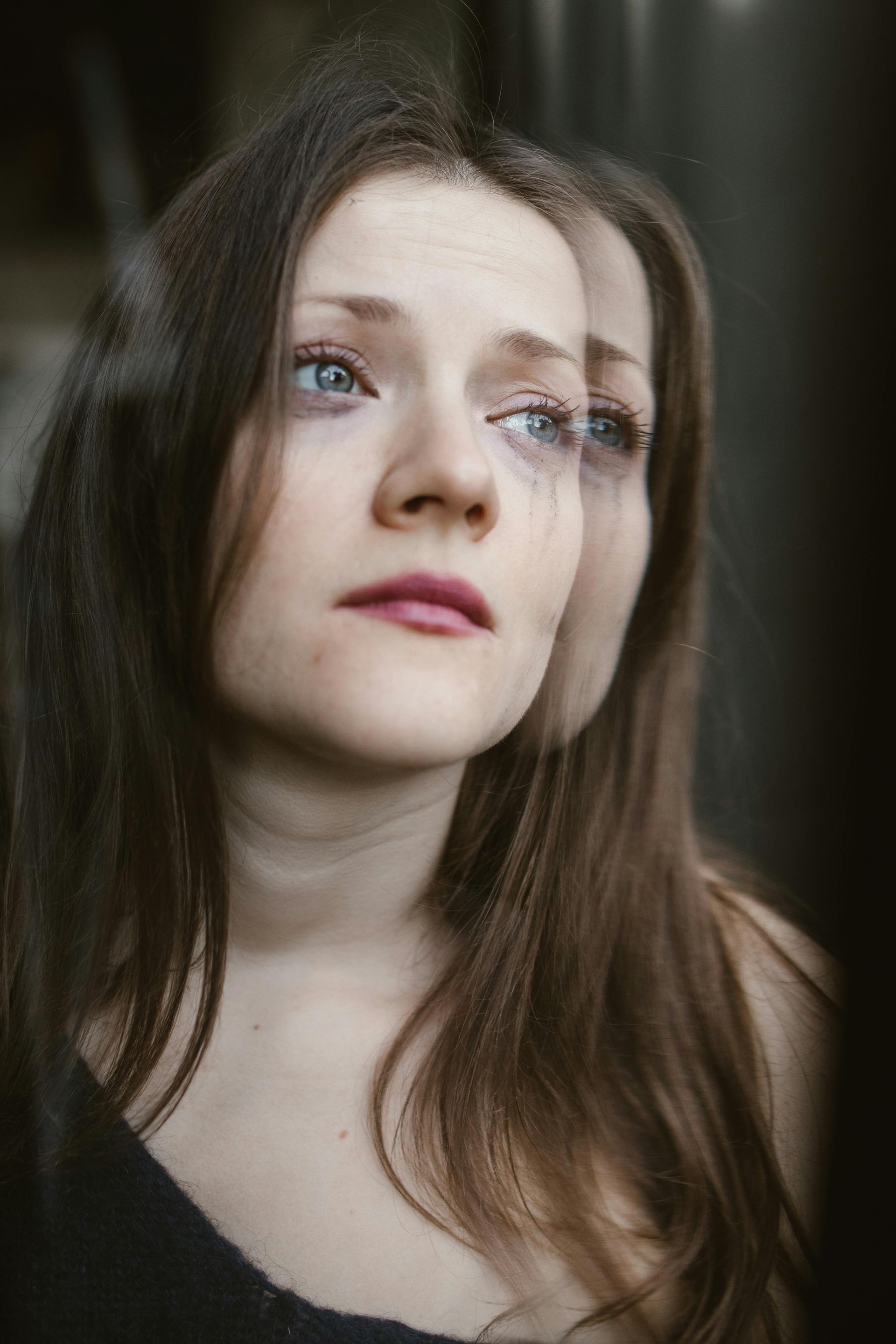 Woman experiencing emotional difficulty, showing why postpartum support services are essential