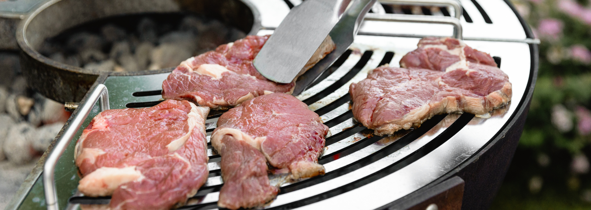 Picture of meat on a BBQ grill. Picture of meat on a BBQ grill.
