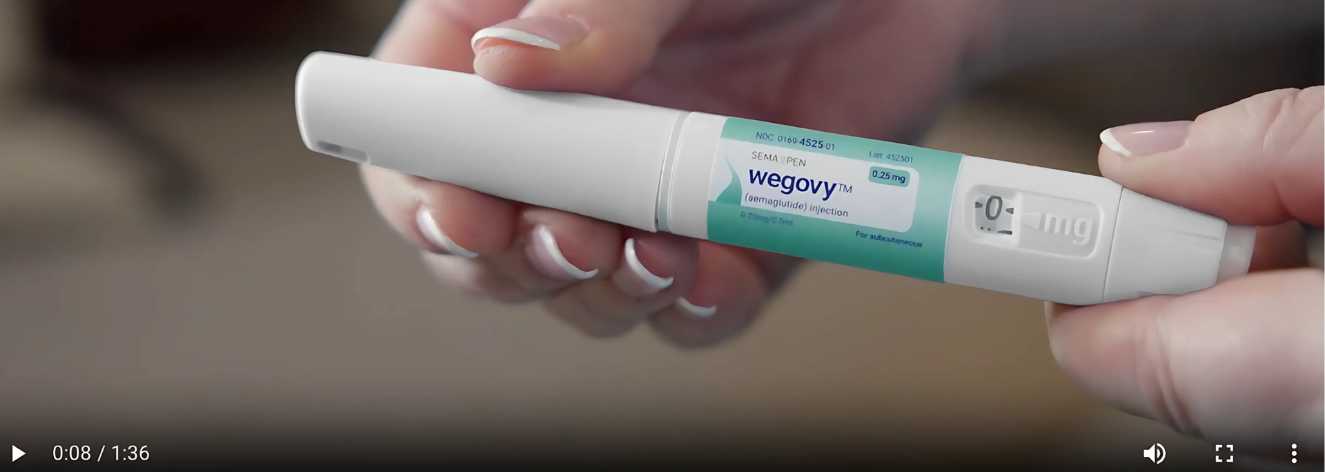 This image shows a professional explaining how to use weight loss injections.
