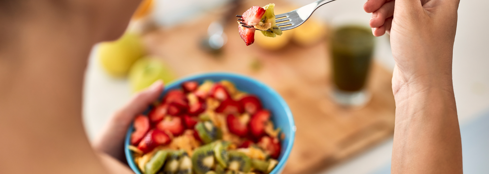 Picture of a person eating a healthy, balanced dish. 