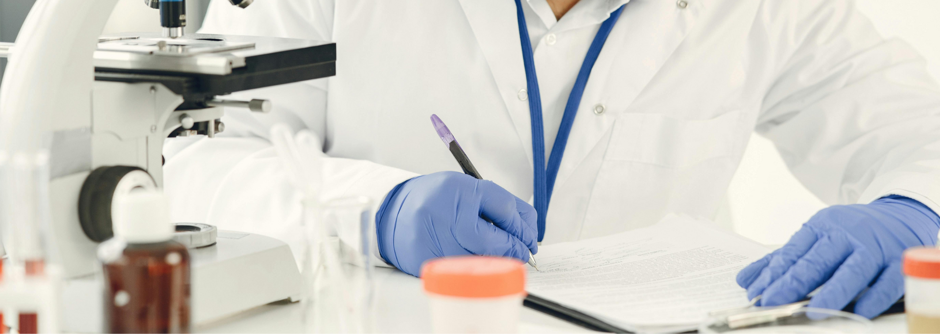 Picture of a lab technician reviewing results.