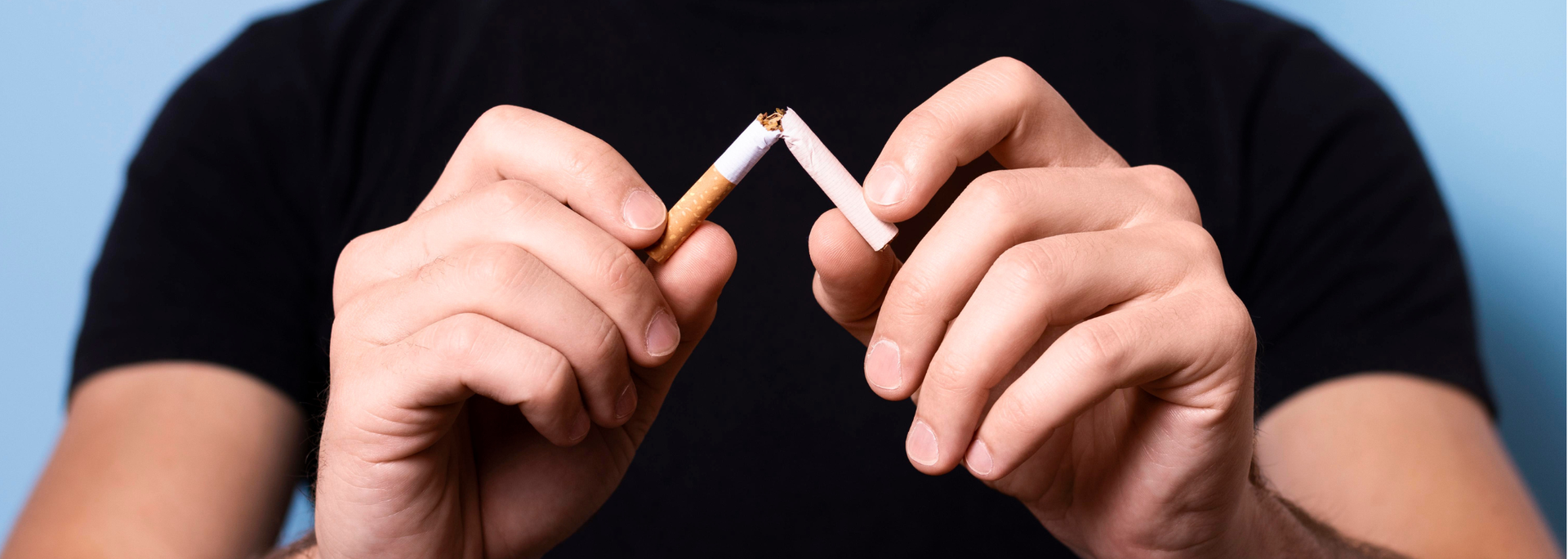 Picture of a cigarette being snapped in half. Picture of a cigarette being snapped in half.