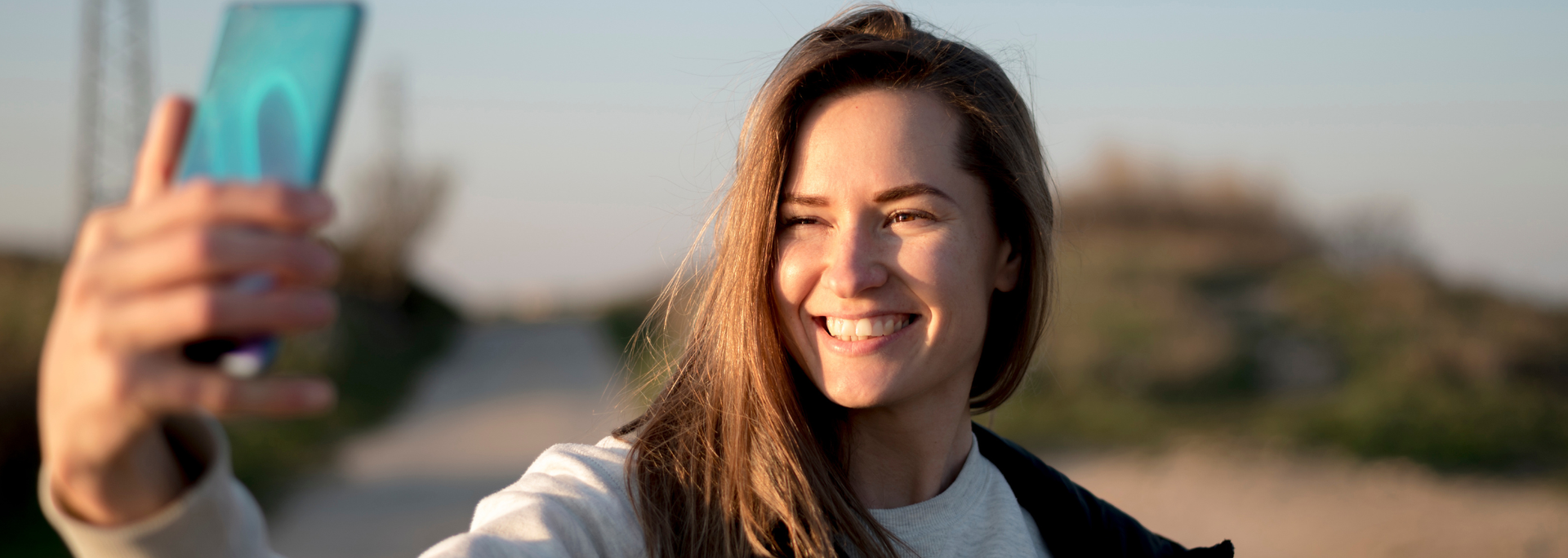 Picture of a person taking a selfie. Picture of a person taking a selfie.