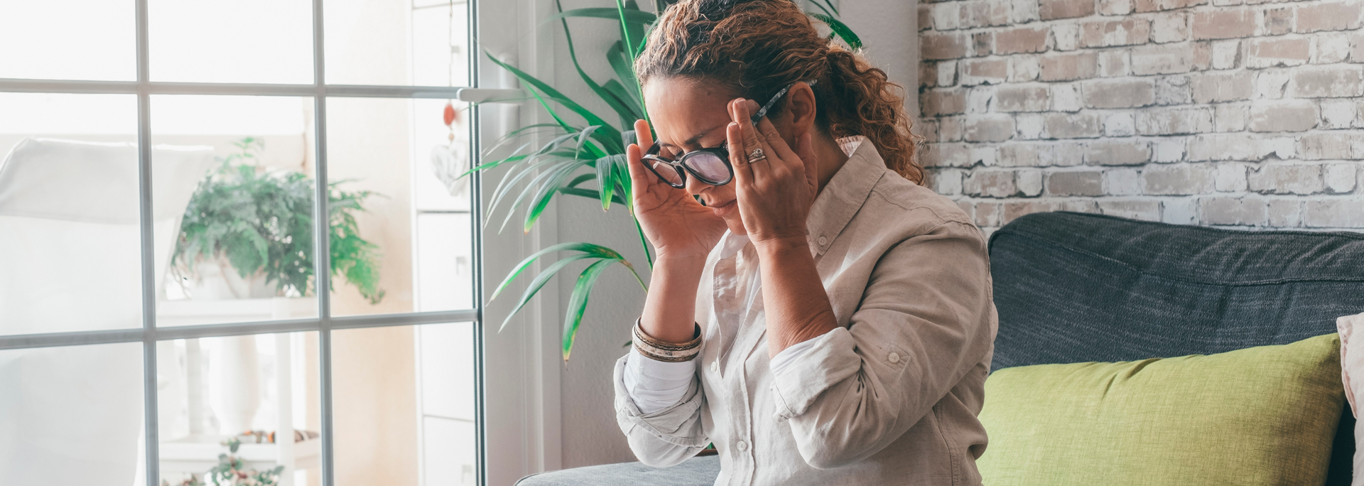 Picture of a person holding their head having a headache. Picture of a person holding their head having a headache.