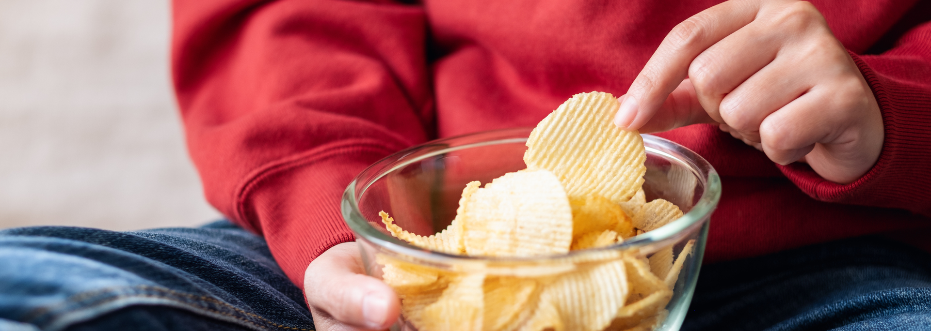 Picture of someone eating crisps. Picture of someone eating crisps.
