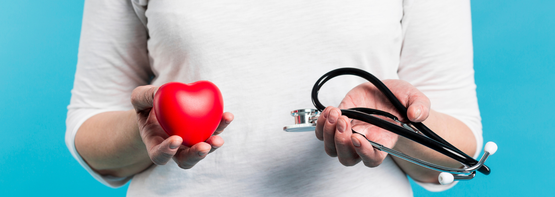 Picture of someone holding a heart. 