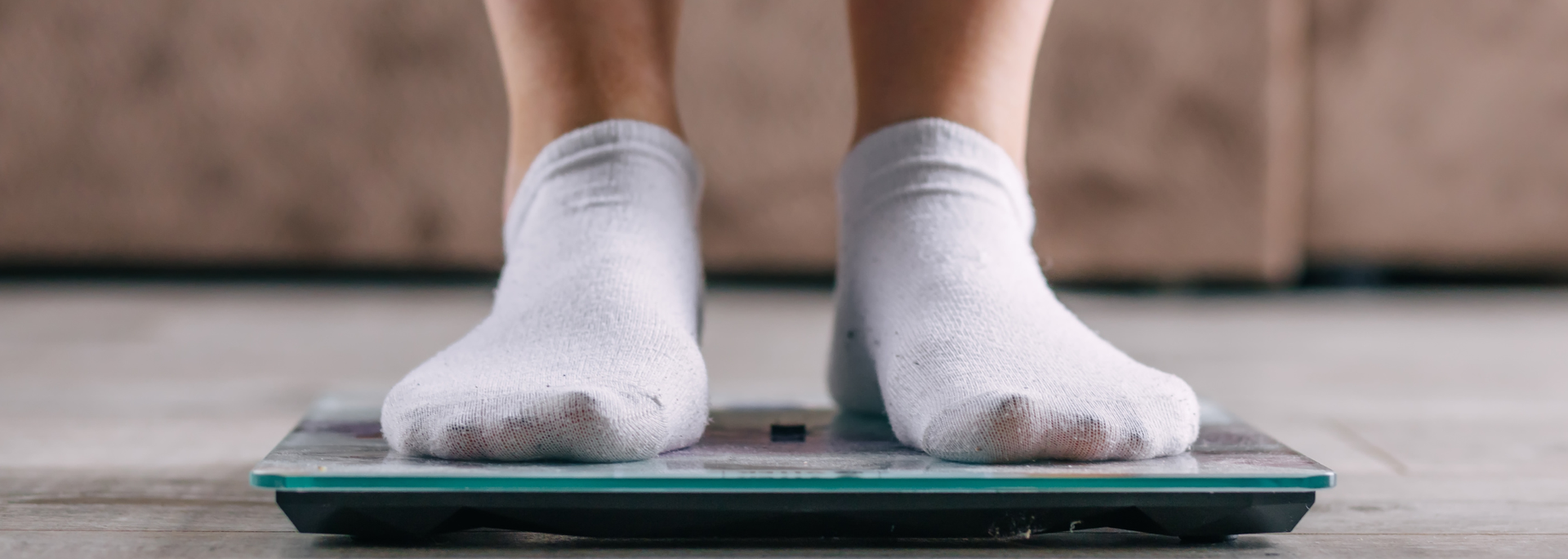 Picture of a person standing on scales.