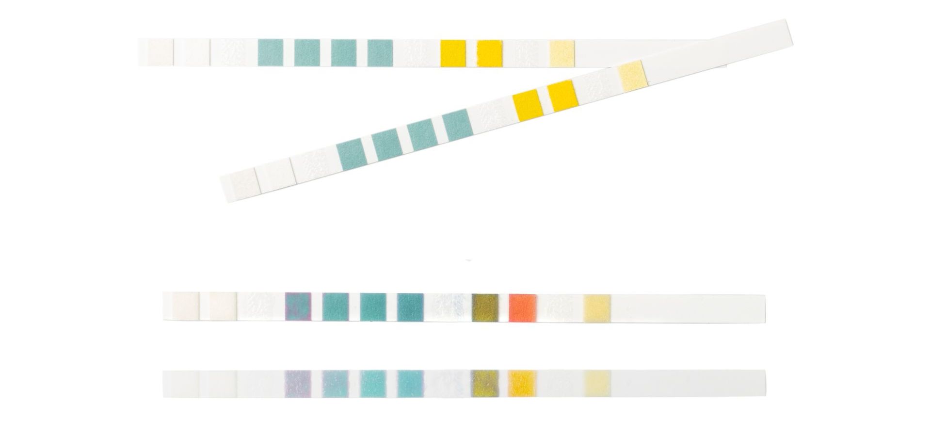 A set of three strips of paper with different colors on a white background.